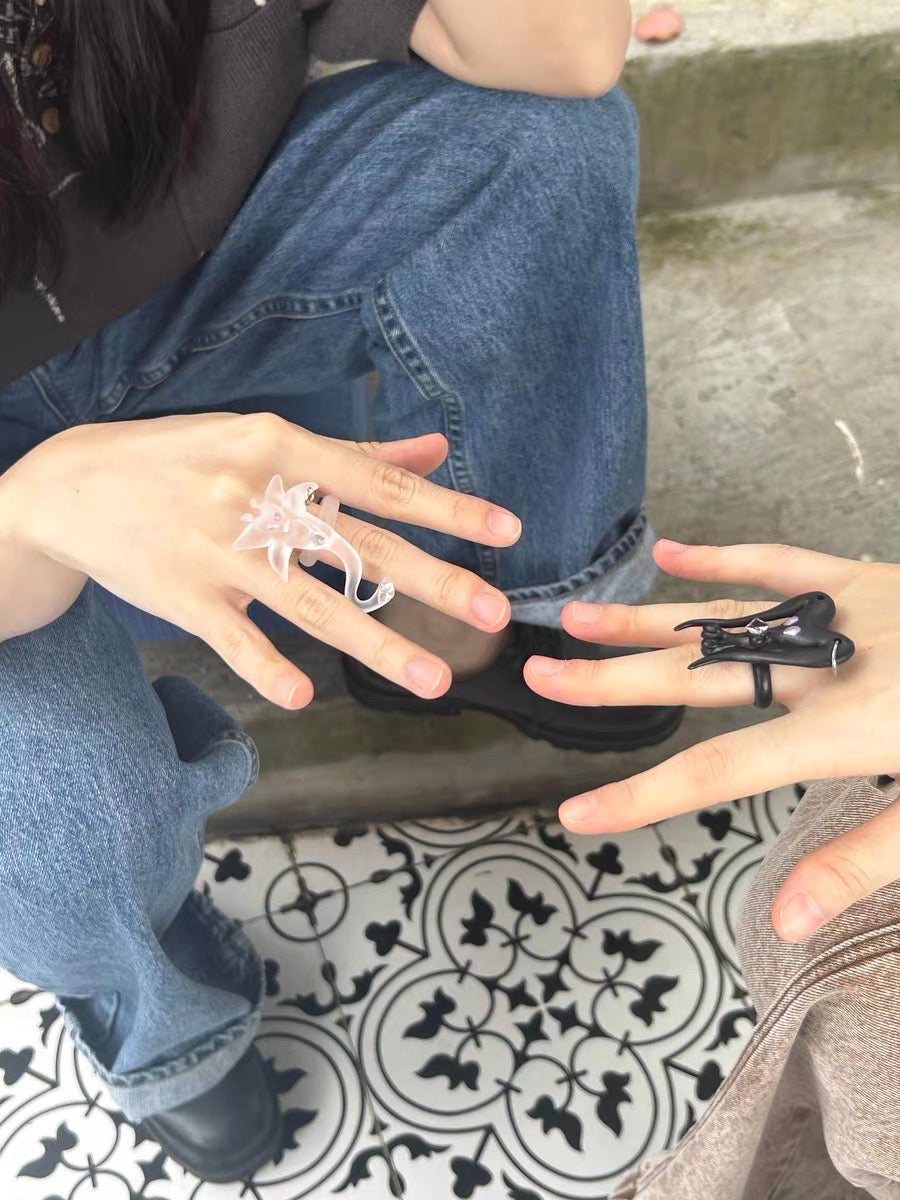 Take a break. Transparent alien creature named Norma's ring.